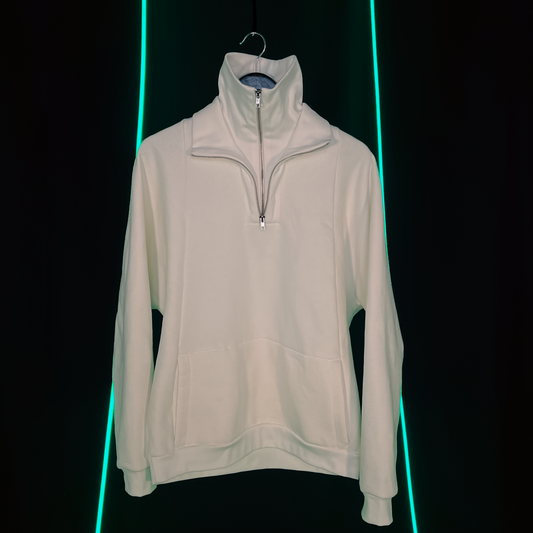 A beige, quarter-zip, hooded sweater displayed against a dark background with neon green light accents on the sides.
